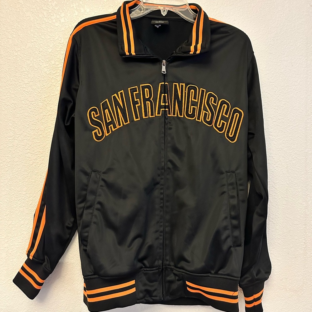 Black medium jacket with San Francisco stitched in orange on the front.